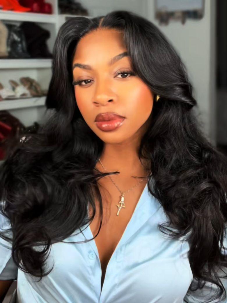 A model displays the UNice 180% Density 7x5 Bye Bye Knots Cut Body Curls Lace Wig with Feathered Layers, showing a model with long black hair and a blue shirt and 7x5.