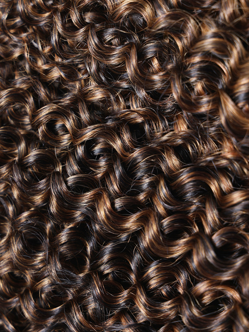 The Unice #FB30 Brown Balayage Jerry Curly 1 Piece Human Hair Bundle product image shows a close up of a hair salon with lots of curly hair and jerry curl texture, curly.