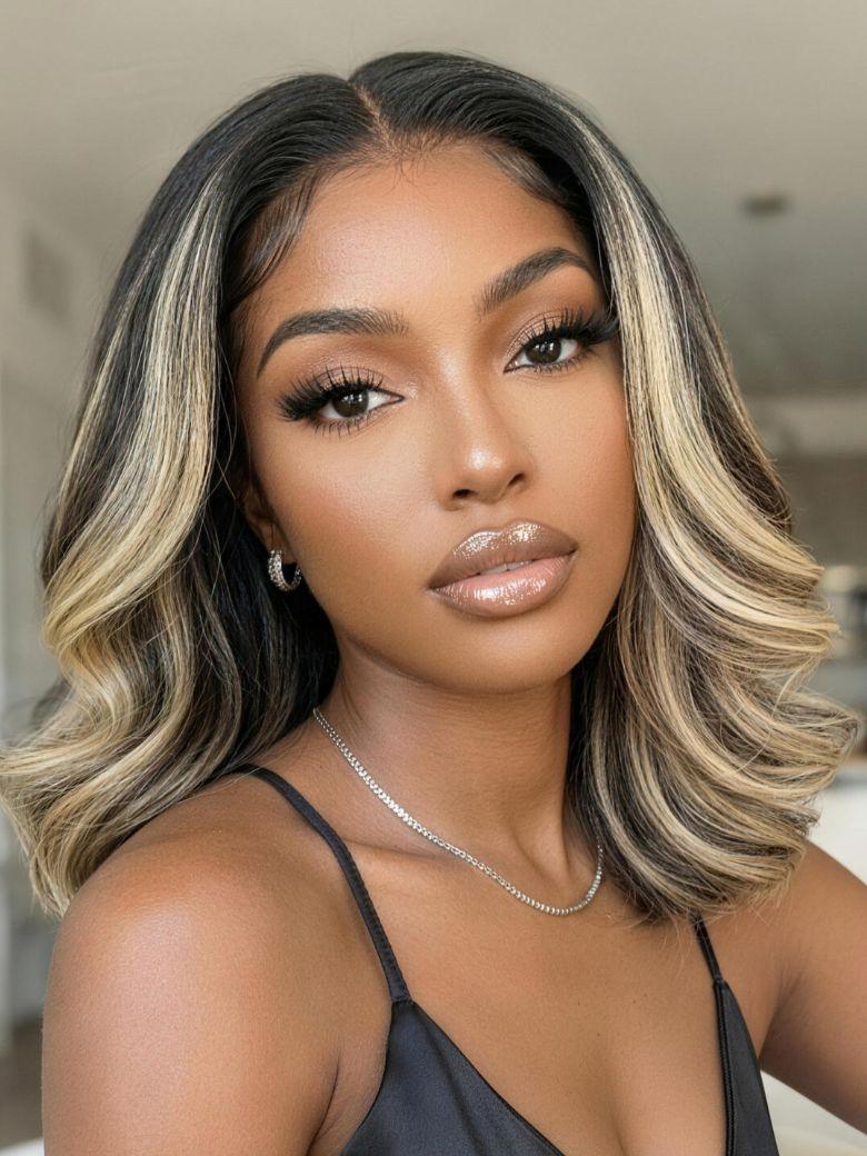 A model displays the UNice 7x5 Bye Bye Slip Lace Dark Brunette with Ash Blonde Highlight Layered Wavy Bob, showing a model with blonde hair and a black top.