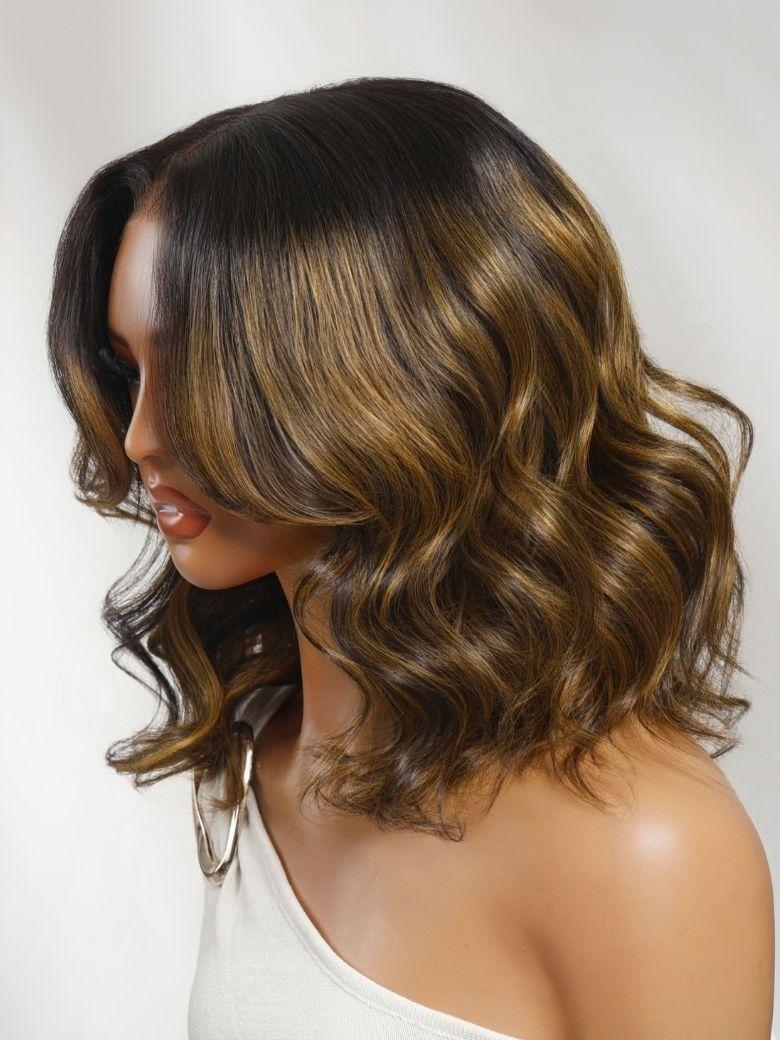 A model displays the UNice Secure Fit All Day UNice 7x5 Bye Bye Slip Lace Balayage Highlights Body Wave wig, showing a model with long wavy brown hair and brown.