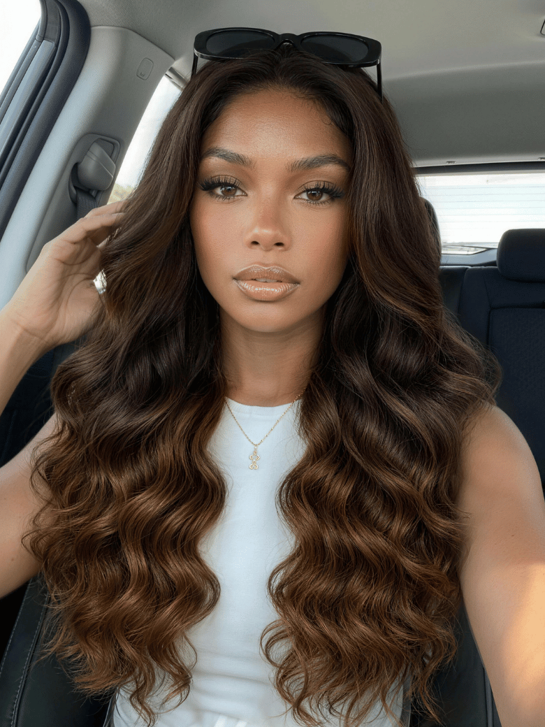 A model displays the UNice 13x4 Bye Bye Slip Lace Frontal Soft Ombre Caramel Brown Balayage Body Wave Wig, showing a woman sitting in a car with a cell and body wave.