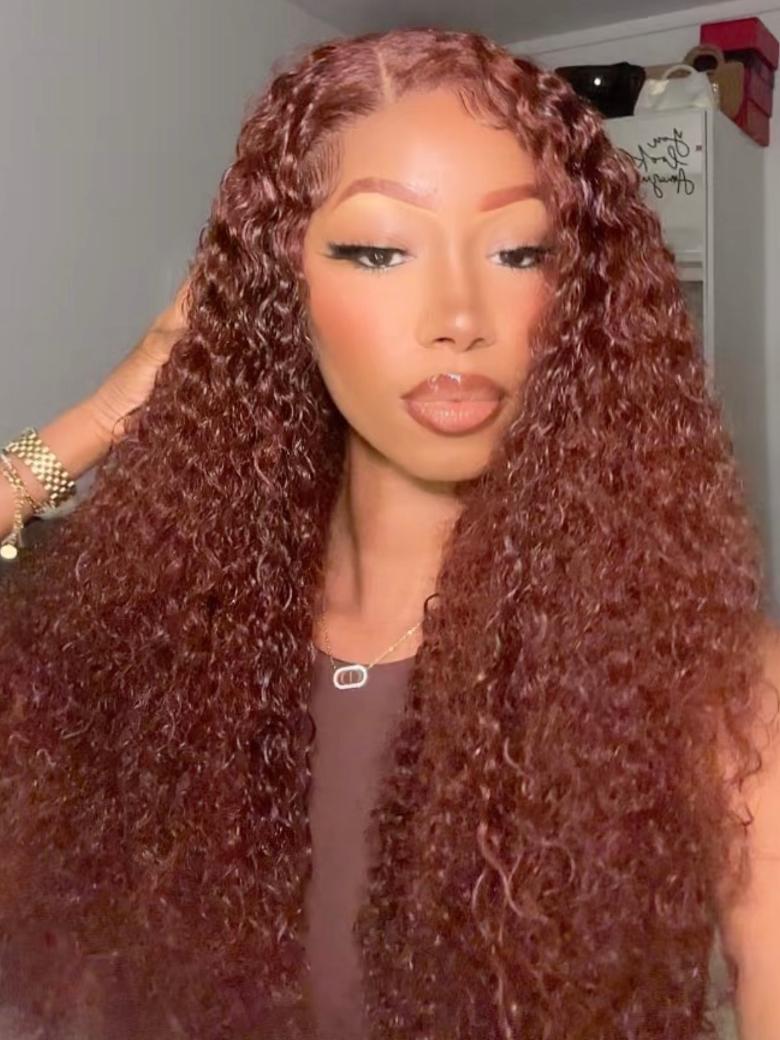 A model displays the UNice Mahogany Red Brown Jerry Curl 3Pcs 100% Remy Human Hair Bundles, showing a model with long curly hair wearing a wig and jerry curl texture.
