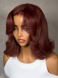 A model displays the UNice Bye Bye Slip 7x5 Lace Warm Brown with Beige Blonde Ribbon Highlights Layered wig, showing a model with blonde hair and a black top sitting.