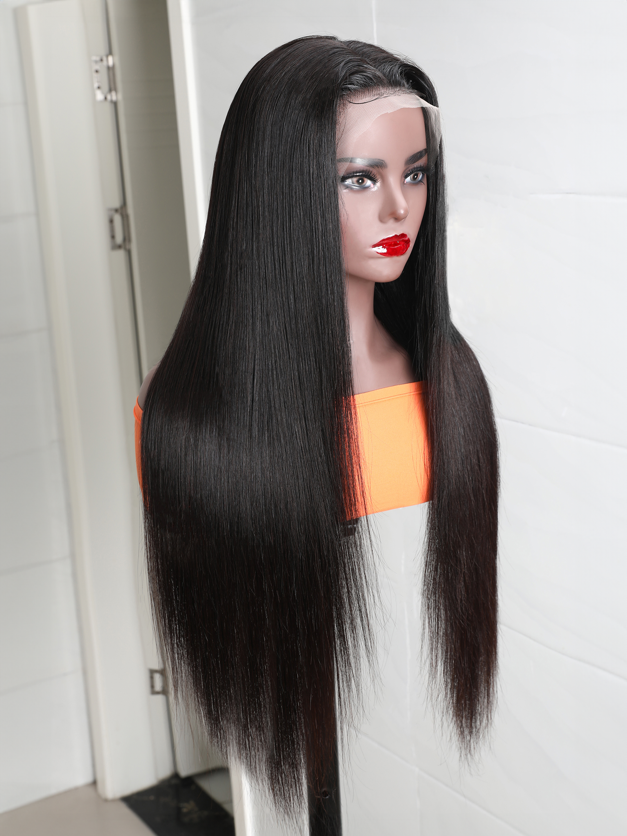 The UNice 280% Density 13x4 HD Lace wig Curly Lace Front wig Human Hair UNice product image shows a manne with long hair and a red lipstick and curly texture, 13x4.