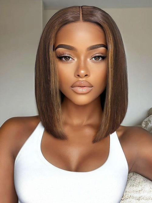 A model displays the UNice 14'' UNice Bye Bye Knots 7x5 Lace Highlight Brown Straight Bob Wig, showing a model with long brown hair and a white tank top and straight.