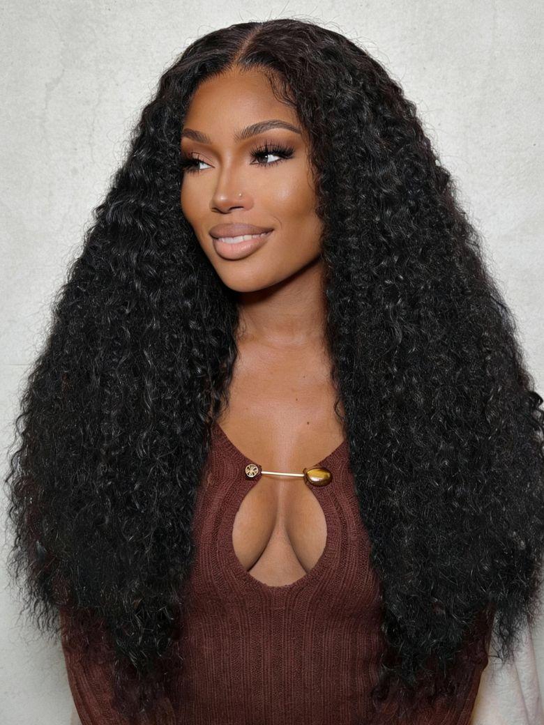 A model displays the UNice 7x5 Lace Bye Bye Knots Black Defined Coils 3C-4A Blend Curly Wig with Invisi, showing a model with long black curly hair and curly texture.