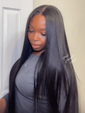 A model displays the UNice 7x5 Bye Bye Knots Glueless Lace Black Yaki Straight With Invisible Drawstring, showing a model with long black hair standing in front.