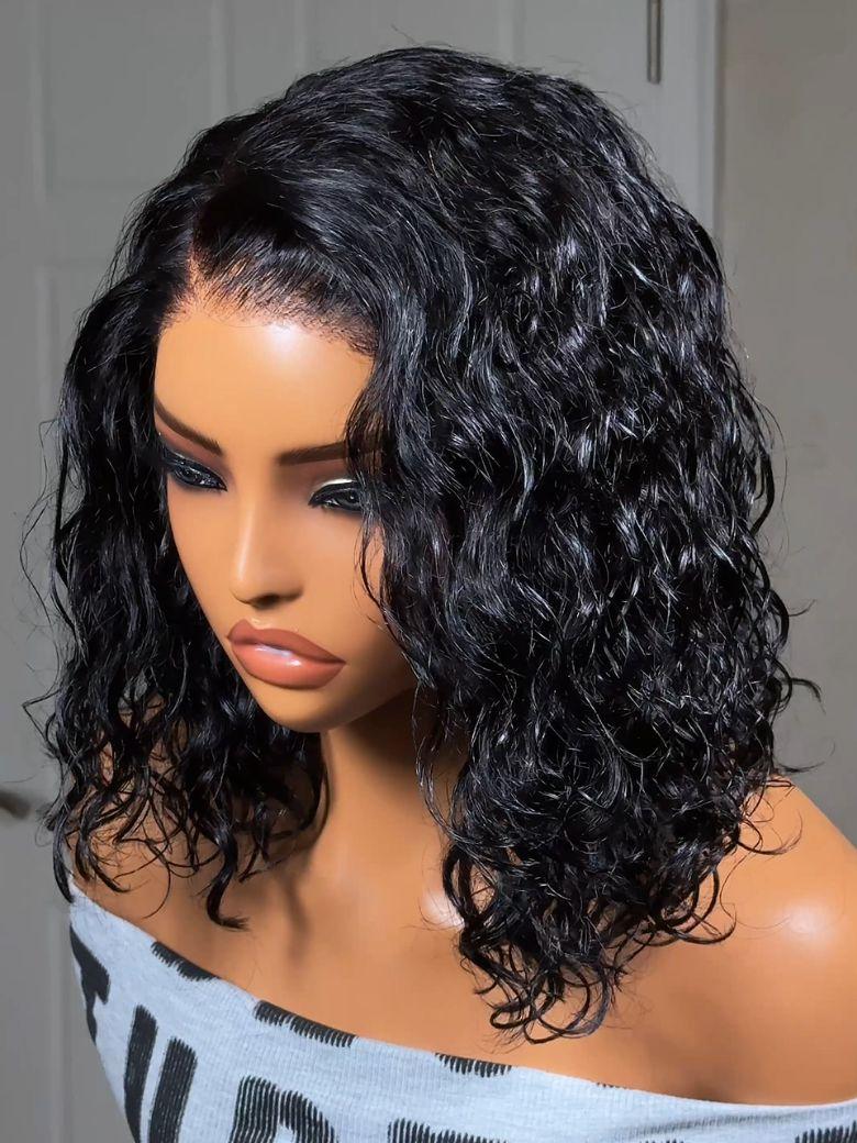 A model displays the UNice Bye Bye Slip 6X4 Glueless Lace "C" Side Part Loose Wavy Bob Drawstring Wig For, showing a model with long curly hair wearing a wig and 6X4.