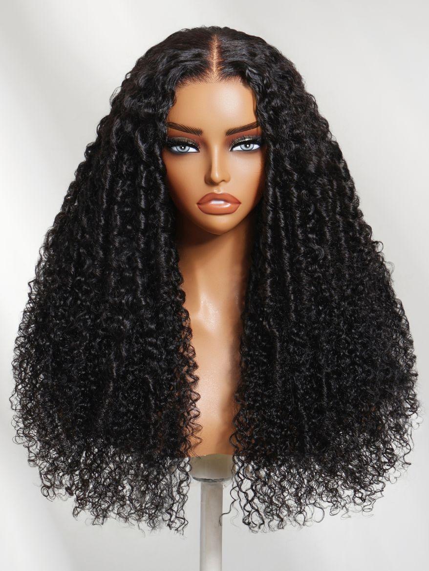 The UNice 18''-22'' UNice 7x5 Lace Bye Bye Knots Black Defined Coils 3C-4A Blend Curly wig visual image position 5 shows a wig with curly hair on a mann | curly texture.