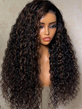 A model displays the UNice Bye Bye Slip 7x5 Lace Warm Brown with Beige Blonde Ribbon Highlights Layered wig, showing a model with blonde hair and a black top sitting.