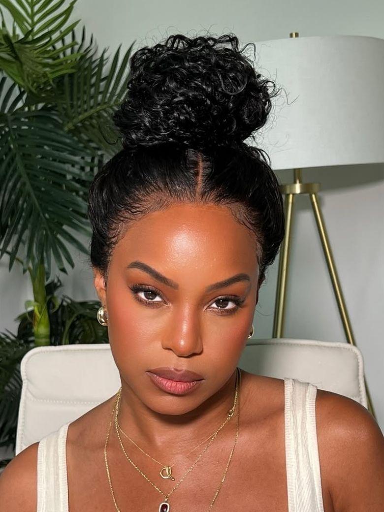 A model displays the UNice Full Lace 100% Handmade Invisible Black Water Wave Human Hair 180% Density Wig, showing a model with a curly hair style and water wave.