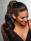 A model displays the UNice Machine-Made Natural Black Loose Wave Clip-In Ponytail Extension, showing a model with long hair and a black dress and loose wave texture.