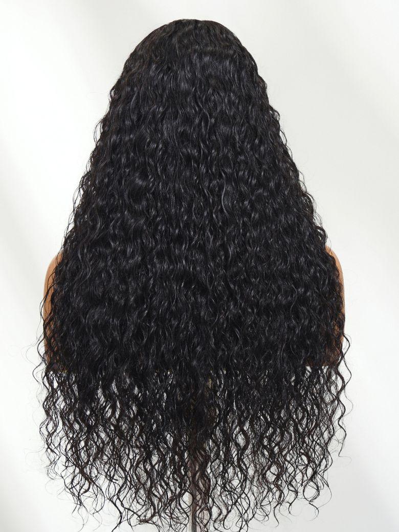 A model displays the UNice Bye Bye Knots 7x5 Lace Mixed Curls Wig with Invisi Drawstring, showing a wig with curly hair on a mann and 7x5, lace finish, drawstring fit.