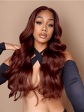A model displays the UNice Dark Auburn Body Wave Remy Human Hair 4x4 Free Part Closure, showing a model with long red hair and a black top and body wave texture, 4x4.
