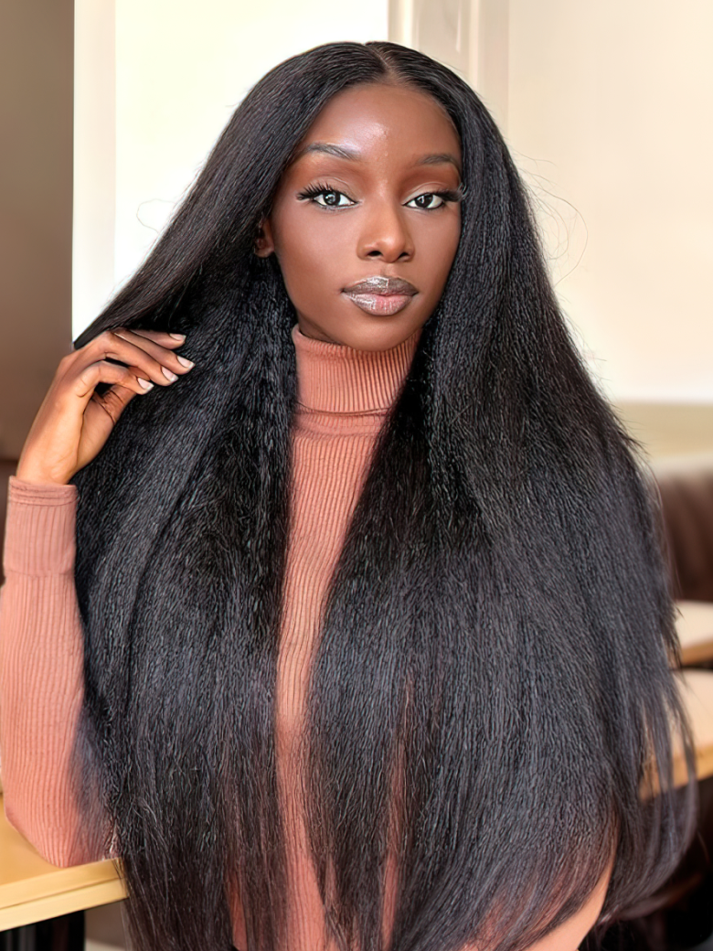 A model displays the UNice '' UNice Kinky Straight Glueless13x4 Lace Front Wig Virgin Human Hair Wig, showing a model with long black hair sitting on a table and kinky.
