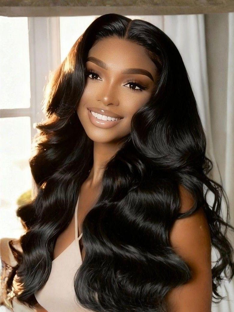 A model displays the UNice Hair Bundle Body Wave Human Weave Hair, showing a model with long black hair and a white dress and body wave texture, bundle fullness.