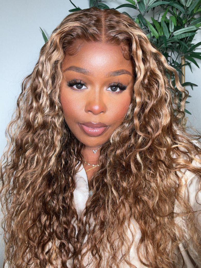 A model displays the UNICE $129 Surprise Box Win 13x4 Lace 200% Density Wig Value $299-$399, showing a model with long curly hair and a white shirt and 13x4, lace finish.