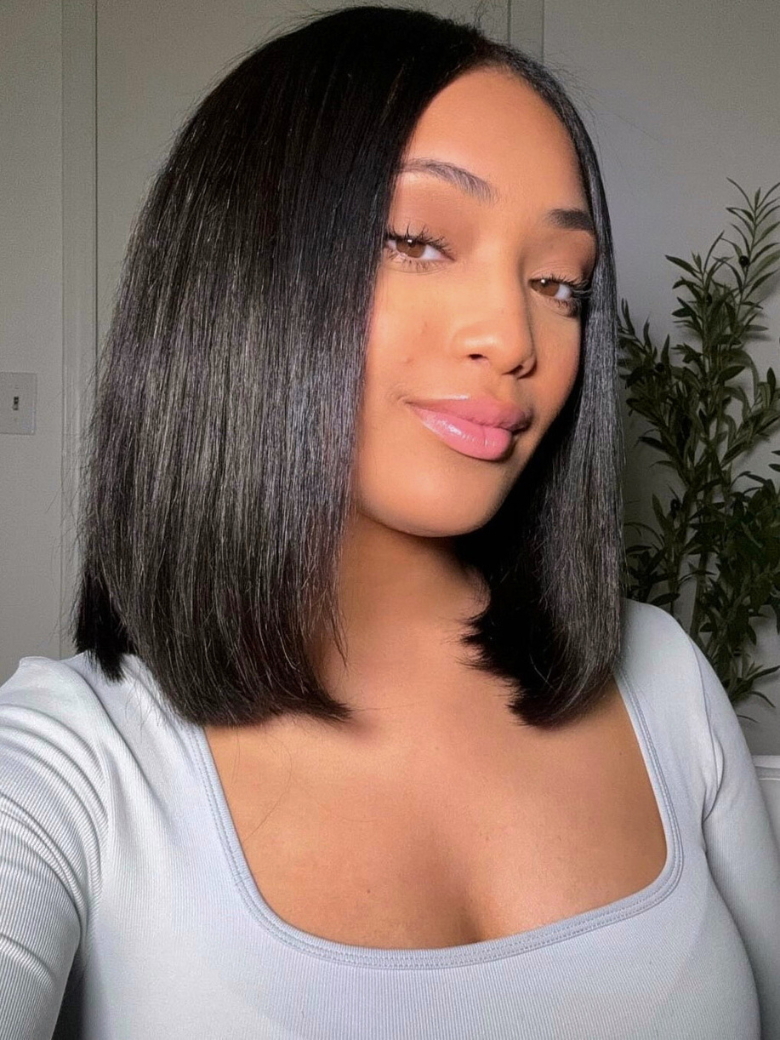 A model displays the UNice Invisi Drawstring 7x5 Put On And Go Lace Summer Style Glueless Lace Bleached wig, showing a model with long black hair and a grey top and 7x5.