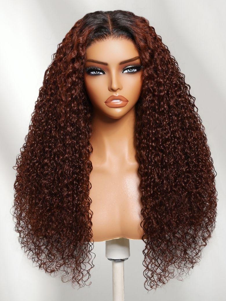 A model displays the UNice 13x4 Pre-Everything Lace Frontal Auburn Red With Dark Roots Gluless Jerry, showing a wig with long curly hair on a mann and jerry curl.