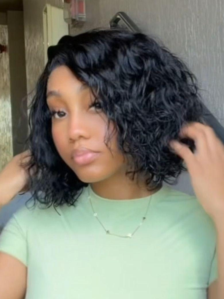 A model displays the UNice Allofdestiny Same UNice Bye Bye Slip 6x4 Glueless Lace "C" Side Part Loose wig, showing a model is straightening her hair with a brush.