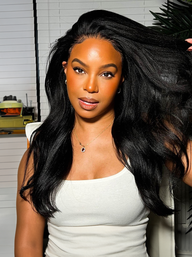 A model displays the UNice Bye Bye Knots Wig 7x5 Glueless Lace Black Yaki Straight Wig With Baby Hair, showing a model with long black hair in a white top and straight.