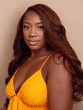 A model displays the UNice Dark Auburn Body Wave Remy Human Hair 4 Bundles With Closure Deal, showing a woman in a yellow dress posing for a photo and body wave texture.