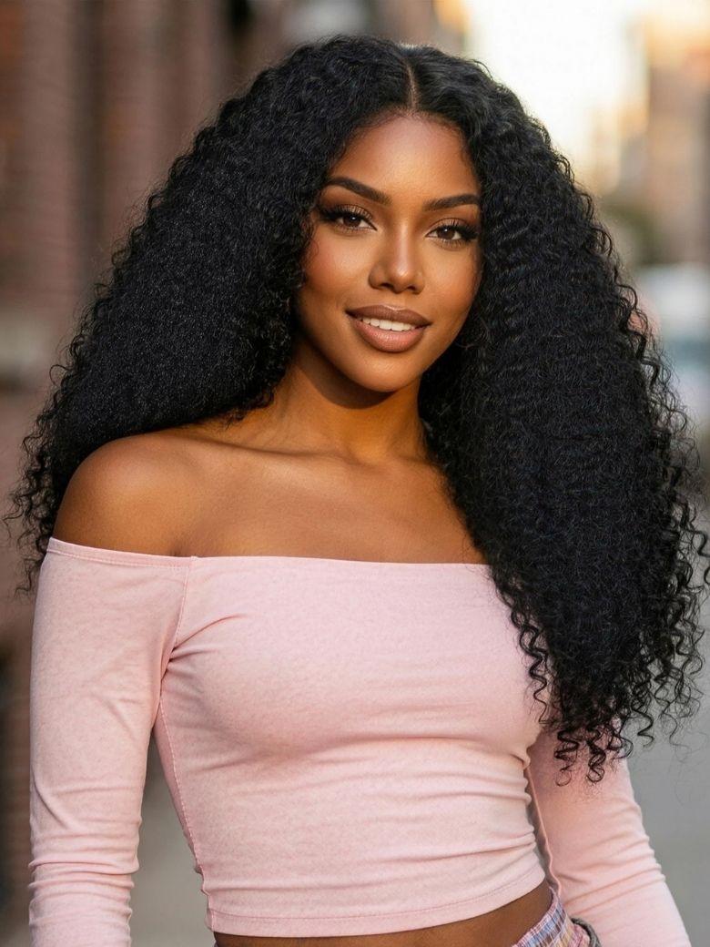 A model displays the UNice 7x5 Bye Bye Slip Black Fluffy Kinky Coils Texture Wig with Invisi Drawstring, showing a model with long curly hair wearing a pink top.