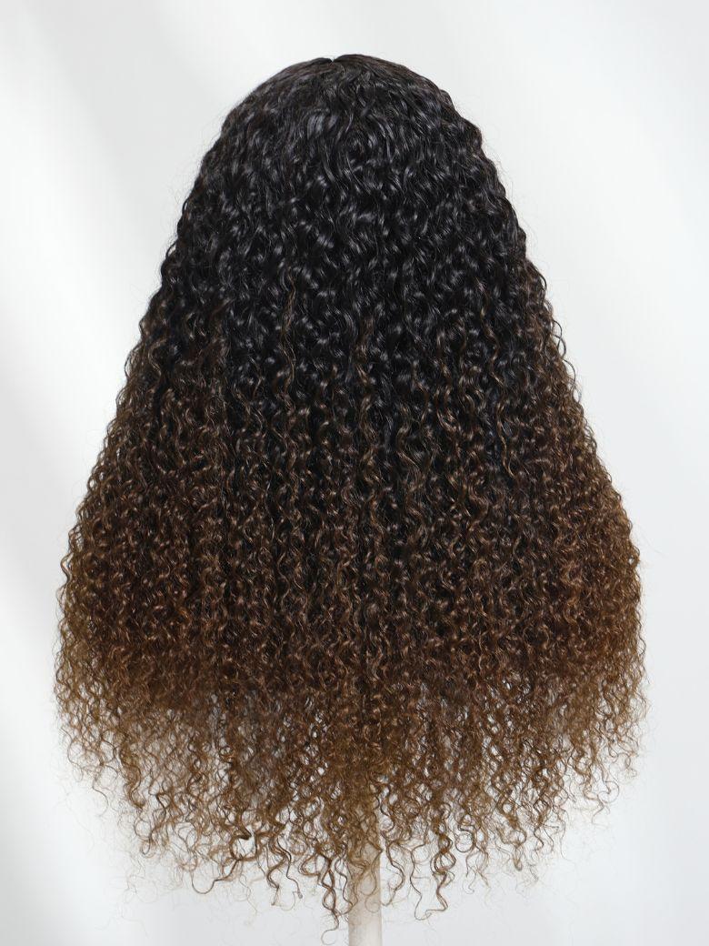 A model displays the UNice EasiContour V Part Black to Chestnut Brown Jerry Curly Drawstring Wig 150%, showing a wig with curly hair on a white background and jerry curl.