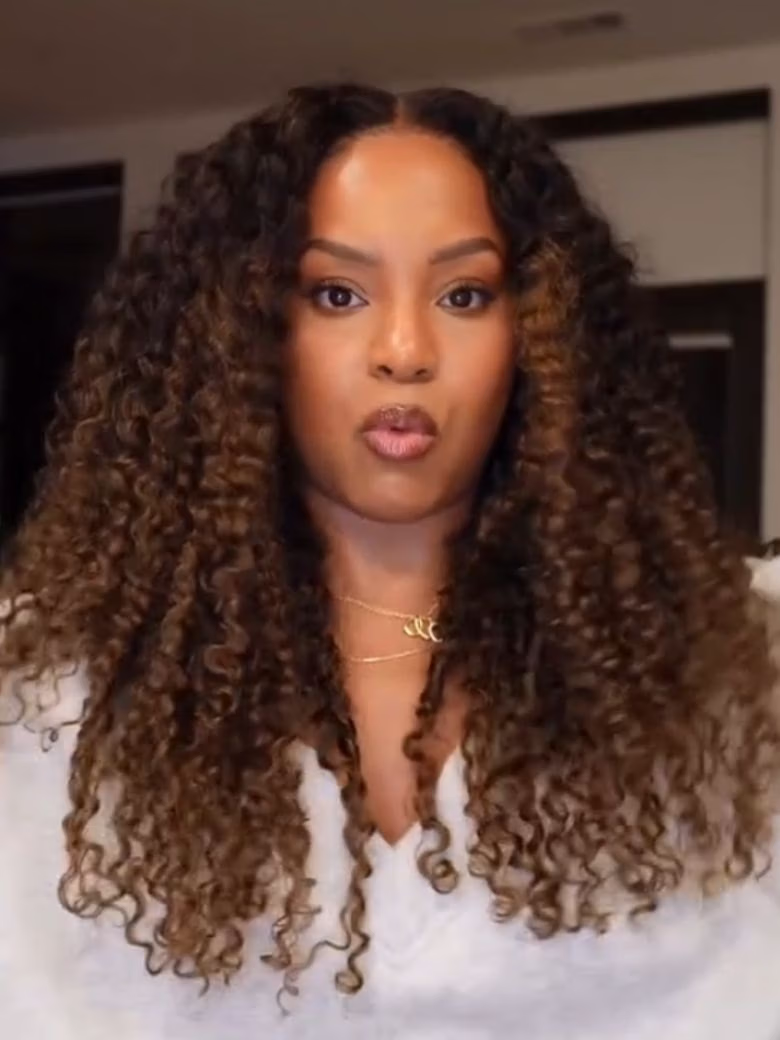 A model displays the UNice 7x5 Bye Bye Slip Glueless Lace Black to Chestnut Brown Ombre Burmese Curly wig, showing a model with long curly hair and a white shirt.