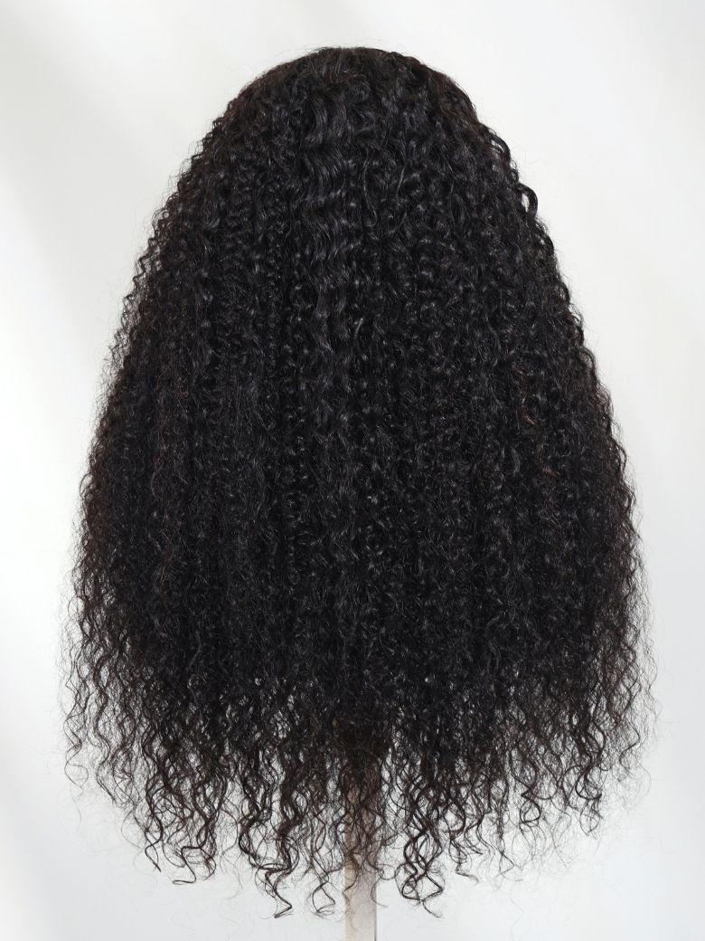 A model displays the UNice Bye Bye Knots 7x5 Lace Multi Textured Water Kinky Curly Wig with Invisi Drawstring, showing a wig with curly hair on a white background.
