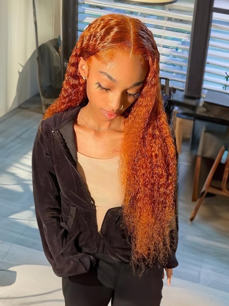 A model displays the Unice Lace Part 150% Density Ginger Color Jerry Curly Human Hair Wig With Invisible, showing a model with red hair standing in a room and jerry curl.