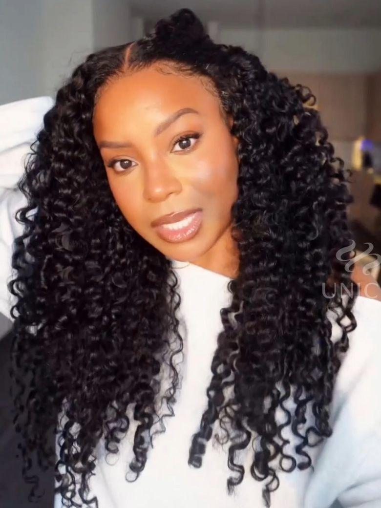 A model displays the UNice Mixed Texture Lace Natural Black Jerry Curly Wig with Defined Finger Coil Ends, showing a model with long curly hair wearing a white sweater.