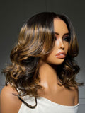 A model displays the UNice 7x5 Bye Bye Slip Lace Balayage Highlights Body Wave Bob Wig with Invisi Drawstring, showing a model with long brown hair and brown.