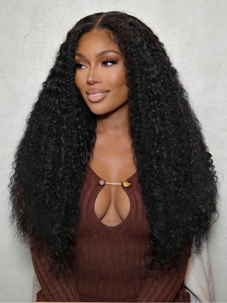 A model displays the UNice 18"-22" UNice Bye Bye Knots 7x5 Lace Multi Textured Water Kinky Curly Wig with, showing a model with long black curly hair and kinky curly.